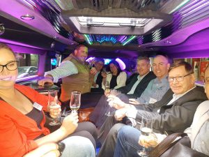 Team drinking in the bar as celebration